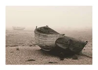 Photograph of old wooden boat on rocky beach in fog-1