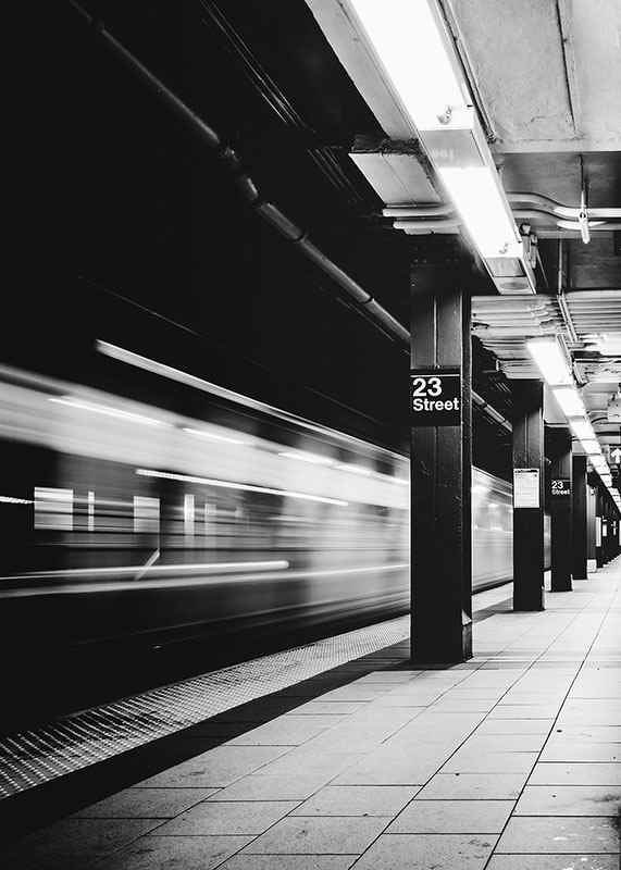 Black and white view of subway platform on 23rd Street in New York-12