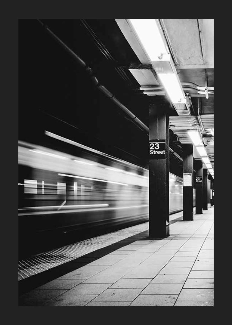 Black and white view of subway platform on 23rd Street in New York-12