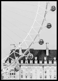 Black and white photo of London Eye against classic building-6