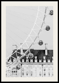 Black and white photo of London Eye against classic building-2