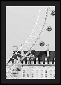 Black and white photo of London Eye against classic building-4