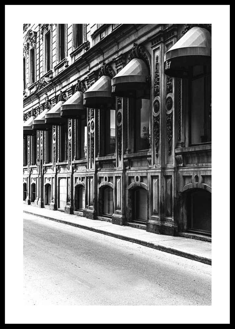 Black and white facade of old city street with decorated windows-12