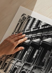 Black and white facade of old city street with decorated windows-9