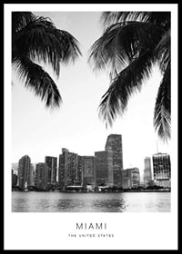 Black and white photo of Miami skyline with palm trees in the foreground-0