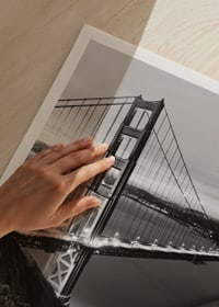 Black and white photograph of the Golden Gate Bridge over the water at dusk-3