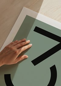 Graphic number three in black against a muted green background-9