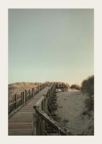Photograph of wooden pier over sand dunes against bright sky-3
