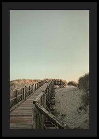 Photograph of wooden pier over sand dunes against bright sky-4