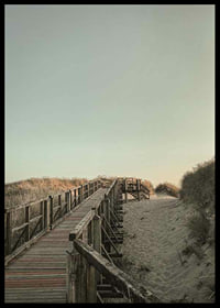 Photograph of wooden pier over sand dunes against bright sky-6
