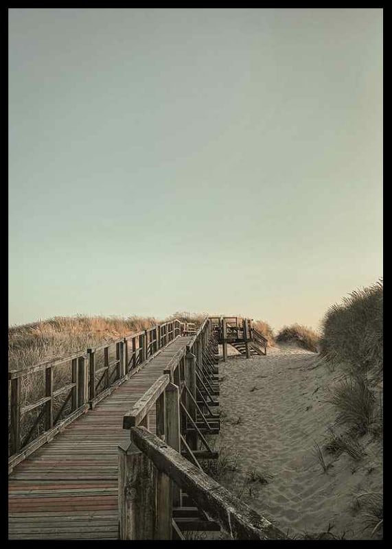 Photograph of wooden pier over sand dunes against bright sky-12