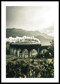 Photograph of train on Glenfinnan Viaduct in green valley-0