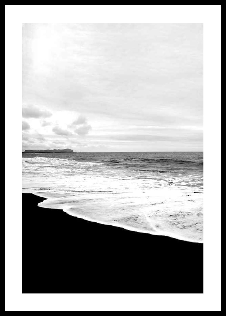 Black and white photograph of waves against dark beach and horizon-12