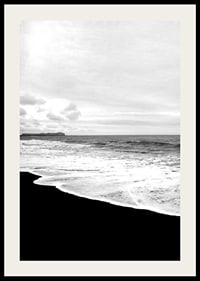 Black and white photograph of waves against dark beach and horizon-2