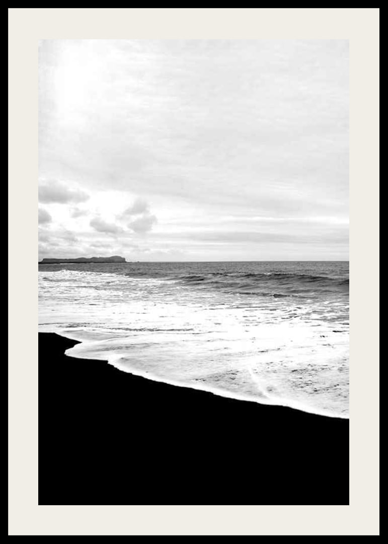 Black and white photograph of waves against dark beach and horizon-12