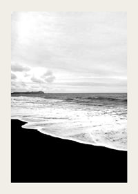 Black and white photograph of waves against dark beach and horizon-3
