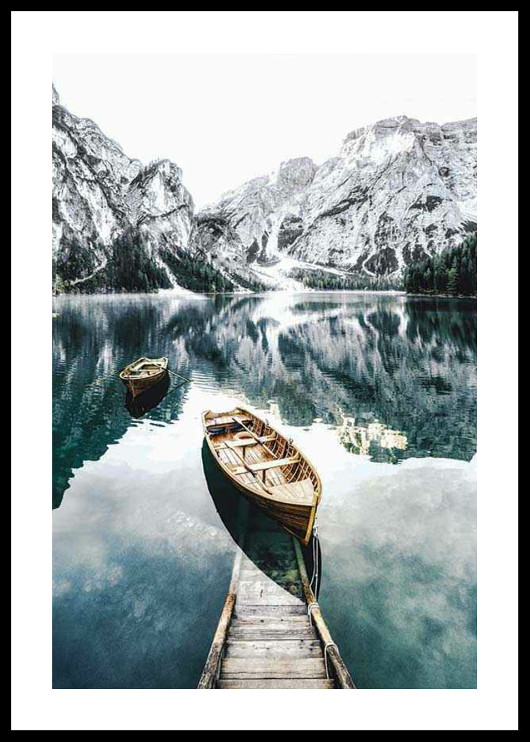 Photograph of rowboats on clear lake with snow-capped mountains-12