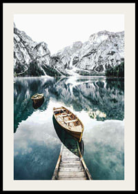 Photograph of rowboats on clear lake with snow-capped mountains-2
