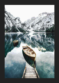 Photograph of rowboats on clear lake with snow-capped mountains-5