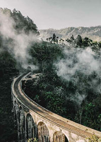 Photographic landscape with railway bridge in foggy jungle-7