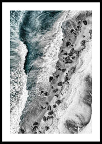 Bird's eye view of rocky beach with turquoise sea water-0