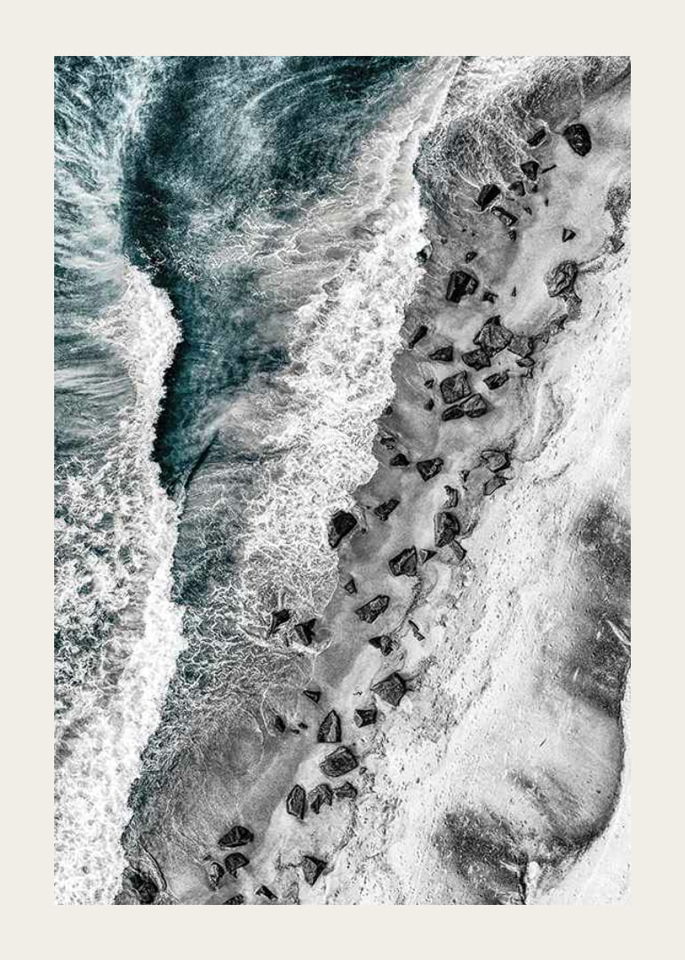 Bird's eye view of rocky beach with turquoise sea water-12