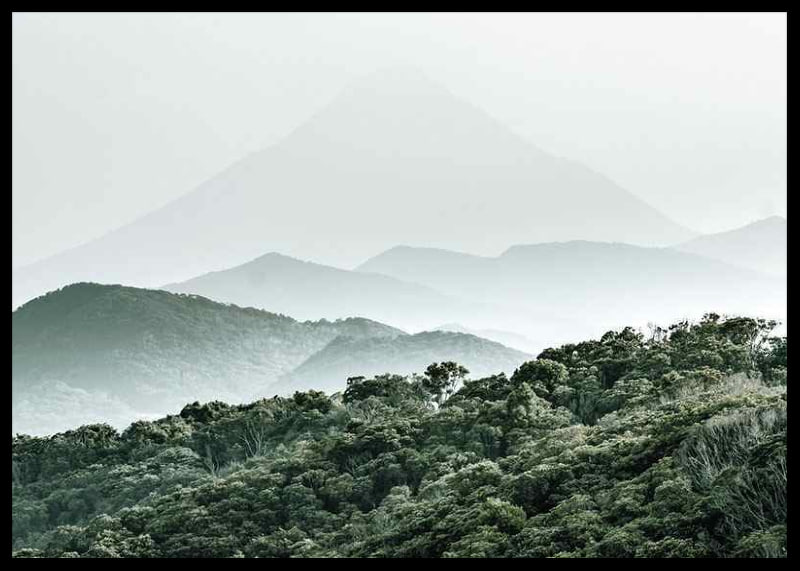 Mist-shrouded mountains and dense forest in soft green tones-12