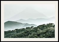 Mist-shrouded mountains and dense forest in soft green tones-2