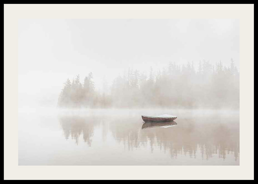 Red rowboat on calm lake with fog and forest in the background-12