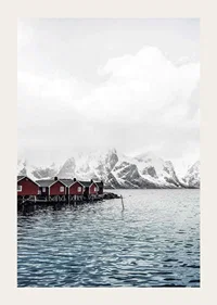 Photograph of red fishing huts by the water and snow-capped mountains-3