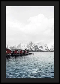 Photograph of red fishing huts by the water and snow-capped mountains-4