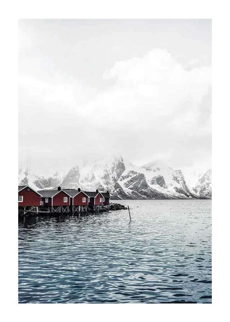 Photograph of red fishing huts by the water and snow-capped mountains-12