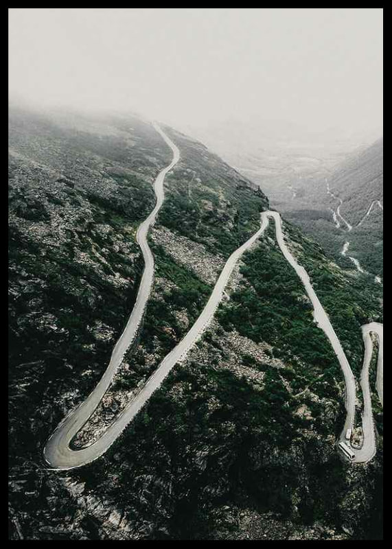 Aerial view of the winding road Trollstigen in a foggy mountain landscape-12