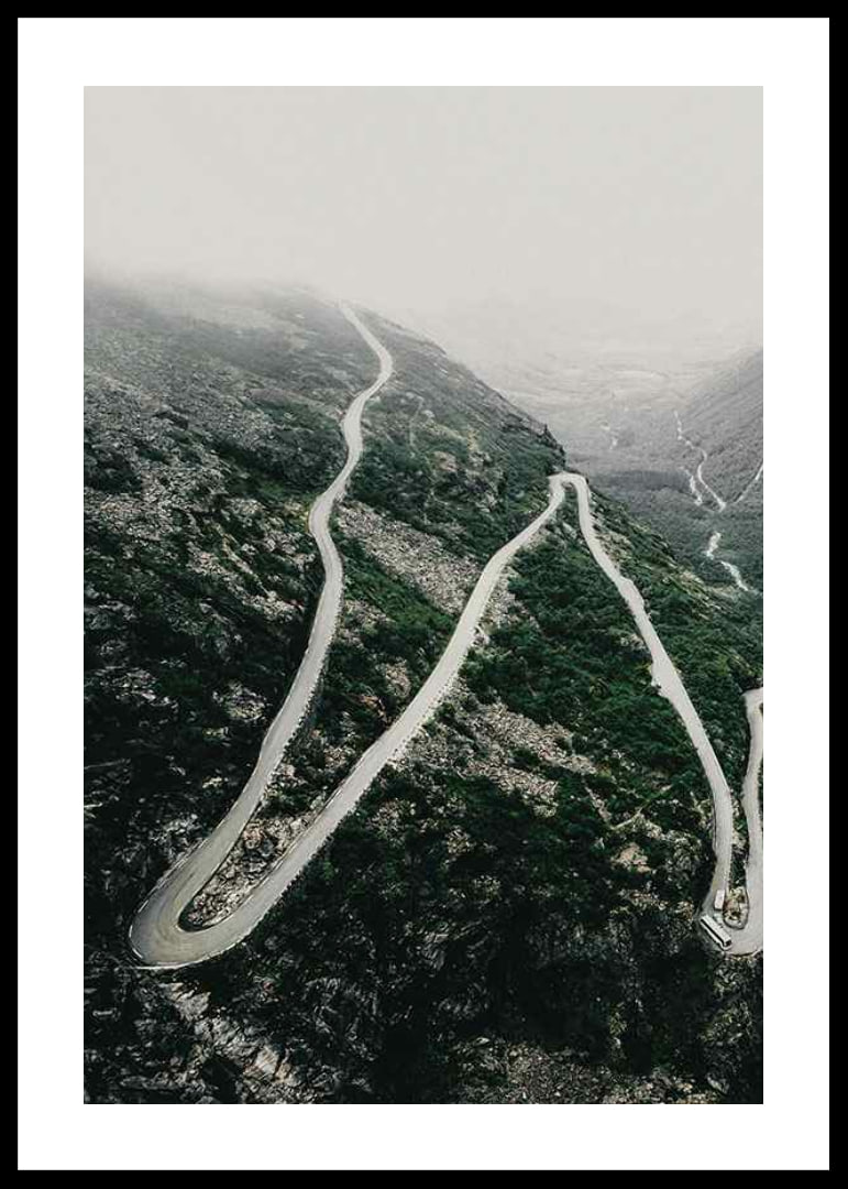 Aerial view of the winding road Trollstigen in a foggy mountain landscape-12