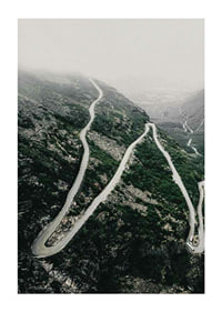 Aerial view of the winding road Trollstigen in a foggy mountain landscape-1