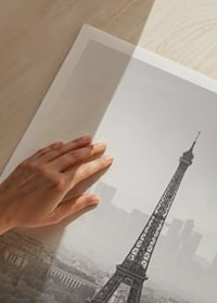 Black and white photograph of the Eiffel Tower with Paris cityscape-3