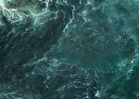 Aerial view of turquoise sea with white wave patterns and foam-7