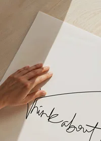 Handwritten black text 'think about it' on white background-3
