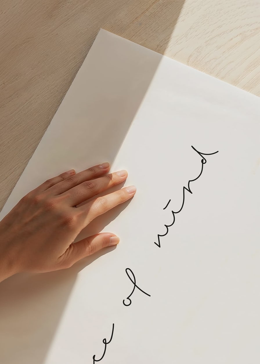 Handwritten text peace of mind in black on white background-12