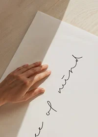 Handwritten text peace of mind in black on white background-3