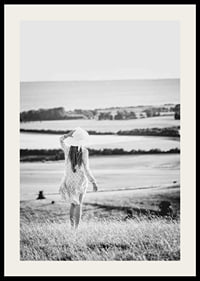Black and white photograph of woman in dress in Danish countryside-2