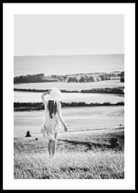 Black and white photograph of woman in dress in Danish countryside-0