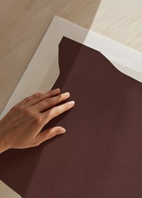 Abstract shape in dark red-brown shades on light background-3