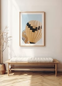 Photograph of yellow and black hot air balloons against blue sky-8