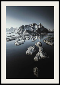 Photograph of snow-capped mountains and small islands on a dark sea-2