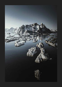 Photograph of snow-capped mountains and small islands on a dark sea-5