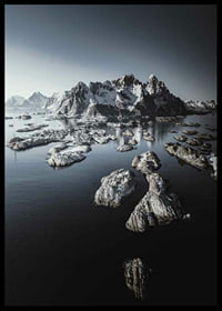Photograph of snow-capped mountains and small islands on a dark sea-6