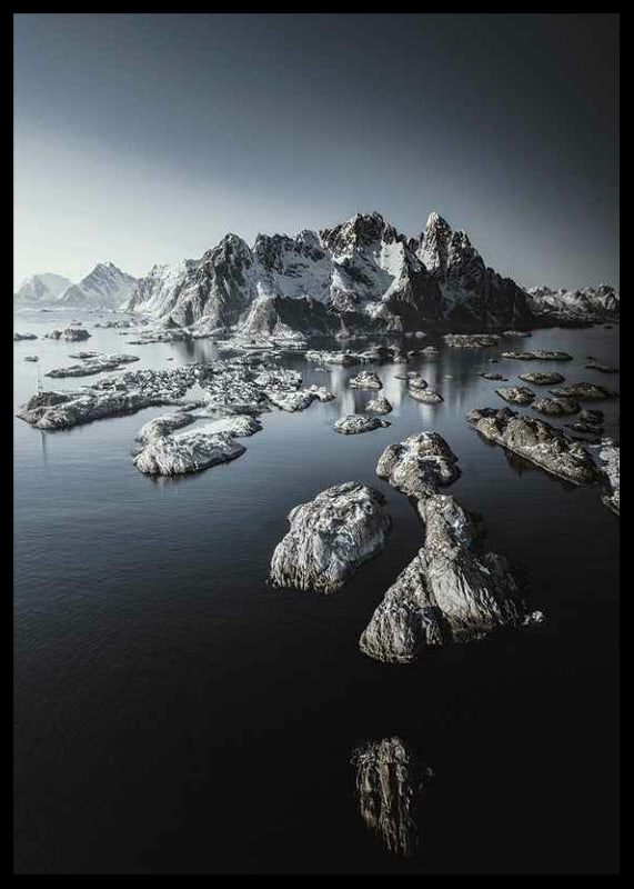 Photograph of snow-capped mountains and small islands on a dark sea-12