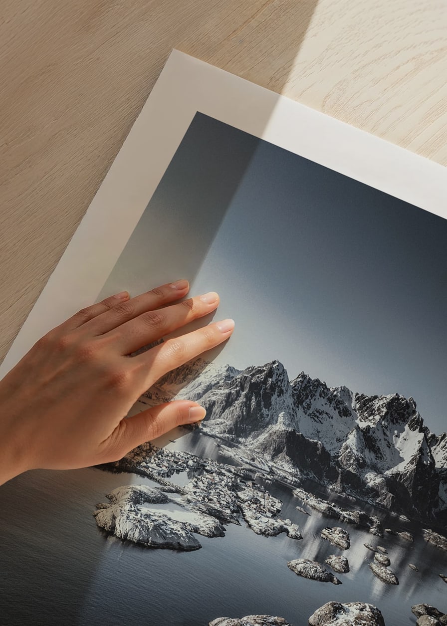 Photograph of snow-capped mountains and small islands on a dark sea-12