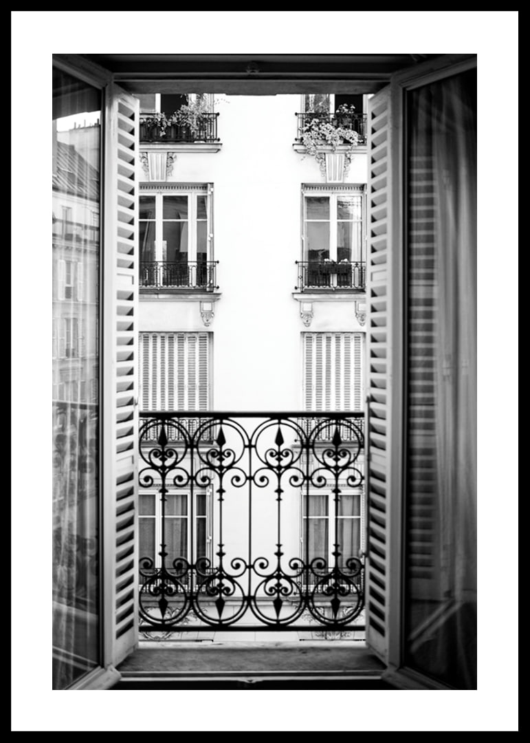 Black and white photo of open window with wrought iron balcony-12